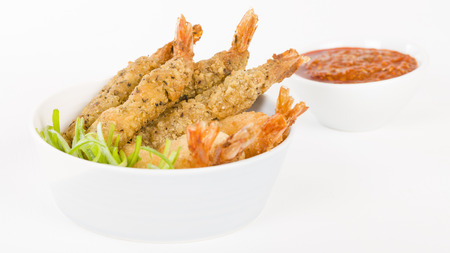 Breaded Prawns - King prawns coated in plain and spicy breadcrumbs and deep-fried.の写真素材