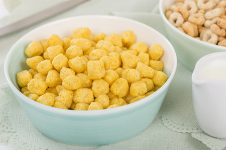 Golden Nuggets - Whole grain cereals in a green bowl.の写真素材