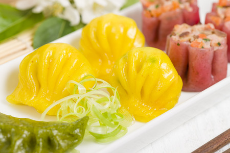 Jiaozi, Har Gow, and Siu Mai - Chinese colourful steamed dumplings. Traditional dim sum set.の写真素材