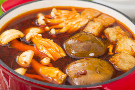 Szechuan Hot Pot - Spicy Chinese hot pot with beef, tofu, prawns, mushrooms, green leaves and...