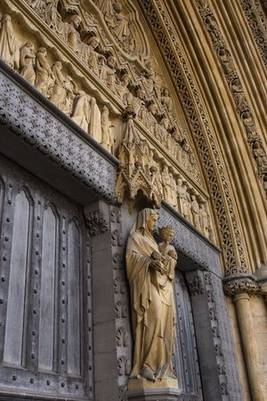 Madonna and Child on the main entrance at Westminster Abbey in Londonの写真素材