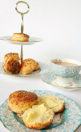 Savoury scones and tea with elegant china. A very English tea-time.の写真素材
