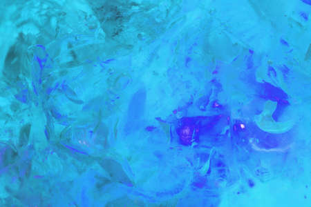 False coloured macro photo of the fractures inside a piece of amber.