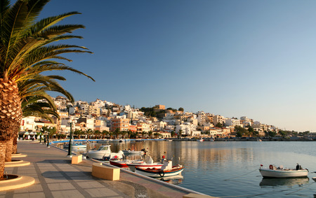 The seafront promenade at Sitia, the main town of Lasithi province, Crete, in early morning light.の写真素材