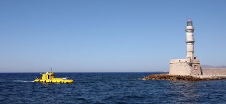 A "yellow submarine" underwater viewing boat for tourists returning to its base in Hania harbour, Crete.の写真素材
