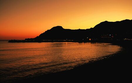Night falls on the Cretan south-coast resort of Plakias, in Greece.の写真素材