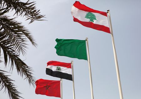 The flags of (from the front) Lebanon, Libya, Egypt and Morocco flying during the Arab League summit in Doha, Qatar, March 2009の写真素材