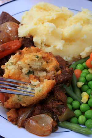 Close-up on the traditional English parsley dumpling in a beef stewの写真素材