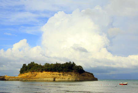 Strongly bedded eroding sandstone formations at Sidari, north Corfu, under a dramatic sky. The...
