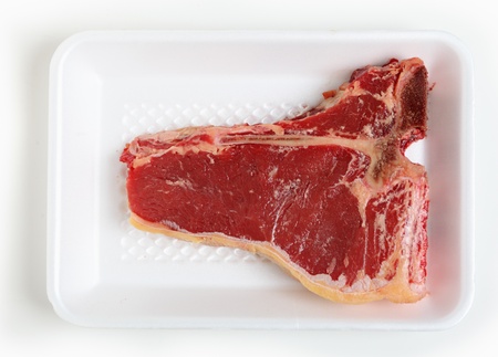 T-bone steak on a polystyrene supermarket trayの写真素材