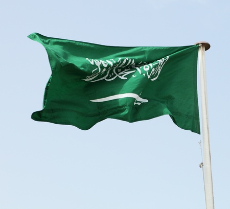 The national flag of the kingdom of Saudi Arabia, with text from the Qur'an and a swordの写真素材