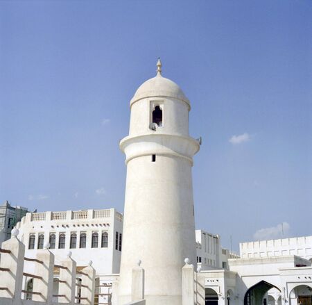 The minaret of a mosque as Souq Waqif, Doha, Qatar, built in the traditional style. Medium format...