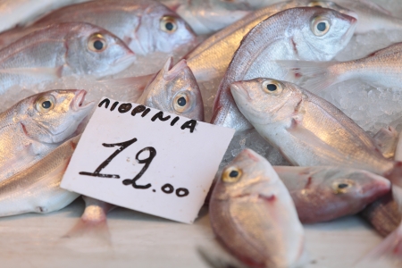 Fish, labelled Lithrinia, on sale in the fish-market at Aegina Town, on the island of Aegina in the Argo-Saronic gulf の写真素材