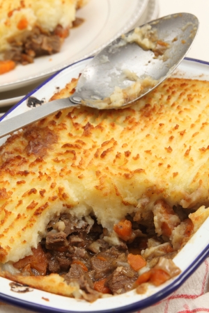 Homemade cottage pie, made with finely chopped cooked meat, onion and carrot, topped with mashed potato and baked until golden  This particular dish is slighly unusual, as it is made with ox tongue rather than minced beef - but it looks the same as any coの写真素材