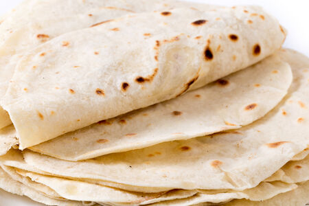 Homemade flour tortillas viewed close-up.