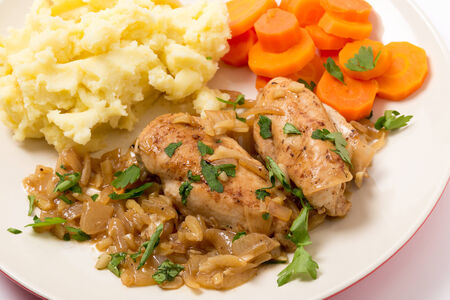 Chicken breasts in an almond, onion and wine sauce, served wth mashed potatoes and carrotsの写真素材