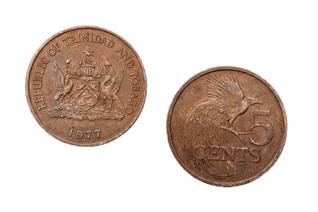 A five cent coin from Trinidad and Tobago featuring a crest on the face side and a bird on the reverse.の写真素材