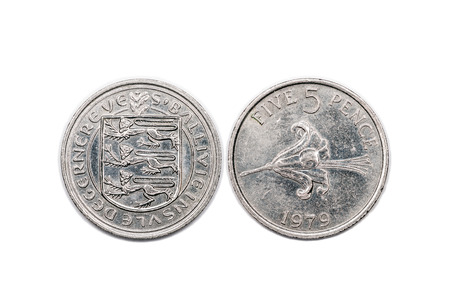 A five pence coin from the Bailiwick of Guernsey and minted 1979. The coin is isolated onto a white backgroundの写真素材