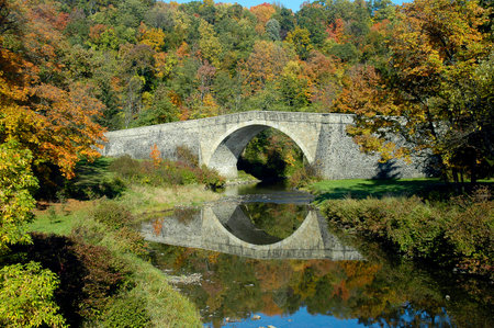 Historic Casselman River Bridge on old National Road in Grantsville, Maryland with fall colors