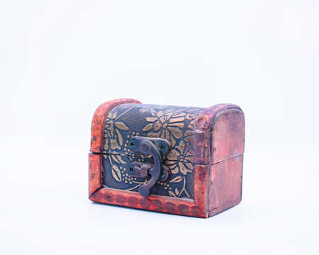 Small wooden and metal chest for gift on isolated white background