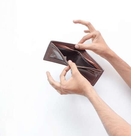 Hands of a man opening his empty wallet on an isolated white background