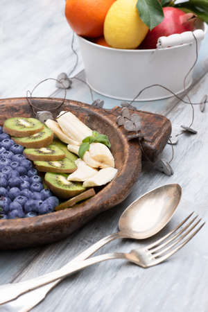 Fresh and various fruits isolated in a shabby chic background. Verticalの写真素材