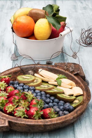 Fresh and various fruits isolated in a shabby chic background. Verticalの写真素材