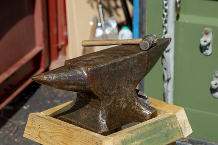 Old anvil and hammer ready for blacksmithの写真素材