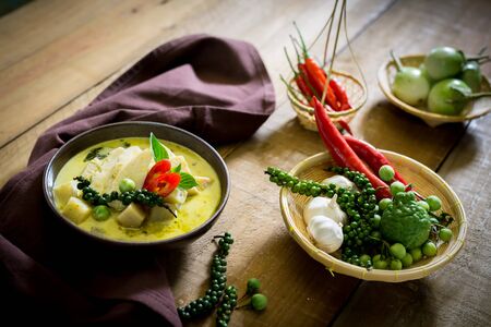 spicy hot chicken green curry with coconut milk soup in bowl,thai food,selective focus.の写真素材