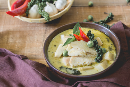 spicy hot chicken green curry with coconut milk soup in bowl,thai food,selective focus.の写真素材