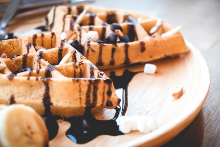 delicious sweet dessert : homemade waffle with chocolate sauce ,selective focus. の写真素材