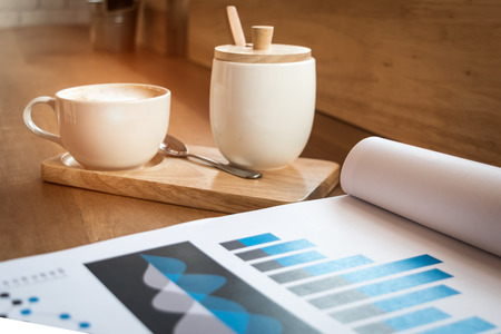 warm vintage concept : hot cappuccino coffee cup in cafe shop ,selective focus. の写真素材