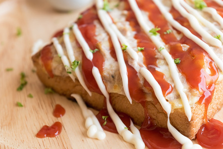 closeup fresh homemade tuna toast slice baked bread with tomato pizza sauce ,selective focus. の写真素材