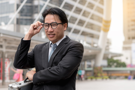 business success concept : businessman celebrating victory outdoors , happiness winner cheerful people ,selective focusの写真素材