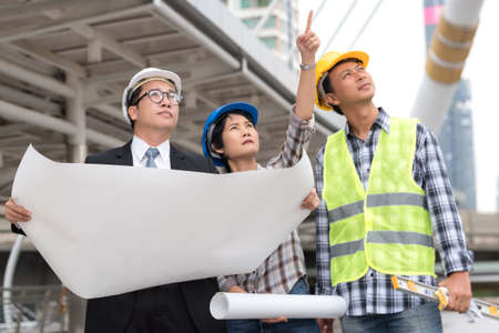 engineering construction concept : professional engineer team meeting foreman group plan manufacturing industry , selective focus の写真素材