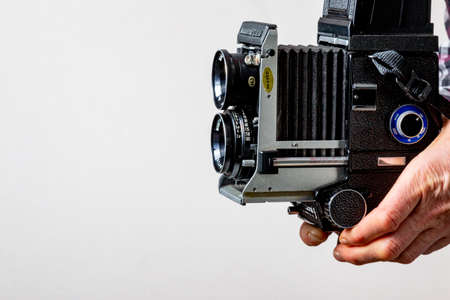 Manchester UK March 2021 classic old bellows film camera man taking photo