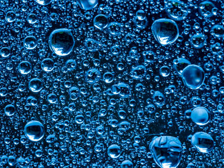 water droplets on glass abstract image blue cool light