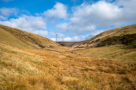 Yorkshire dales UK countryside valley wind turbine at the end on hillsideの写真素材