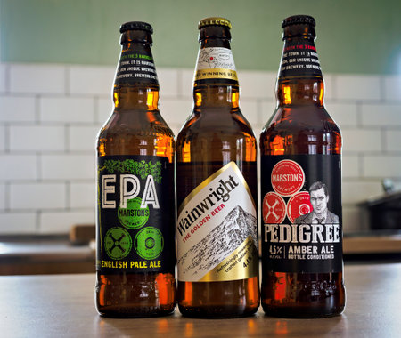 Manchester, UK, September 09, 2024: Three craft beer bottles on a kitchen counter.のeditorial素材