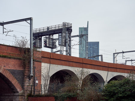 Manchester city. Urban landscape featuring a railway viaduct and modern skyscrapers in the background.の写真素材