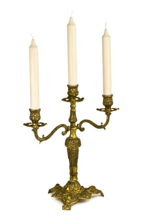 Candlestick with three candles isolated on white.の写真素材
