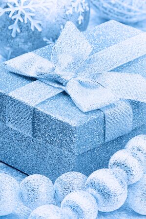 Christmas gift box with festive decoration in blue toneの写真素材
