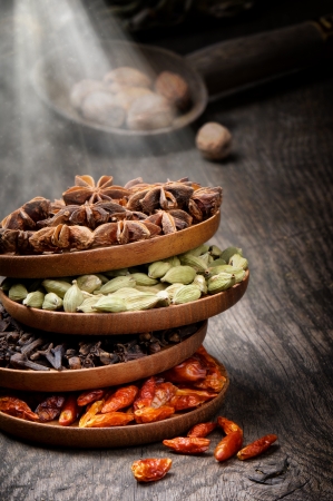 Colorful mix of spices on old wooden tableの写真素材
