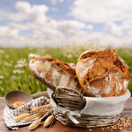 Freshly baked traditional bread in basketの写真素材