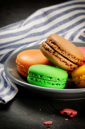 Colorful French macaroons on stone backgroundの写真素材