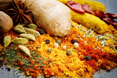 Colorful mix of different spices on stone backgroundの写真素材