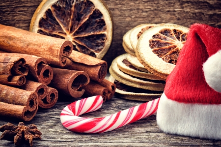 Christmas setting in brown tone with festive spices and candy caneの写真素材