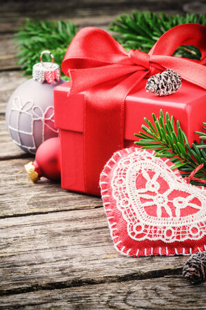 Christmas gift and ornaments in festive settingの写真素材