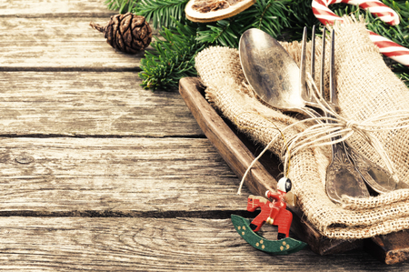 Christmas table setting in retro style on wooden tableの写真素材