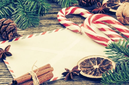 Vintage Christmas frame with envelope and festive decorationsの写真素材